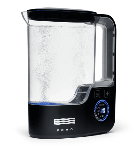 Hydrogen Water Pitcher actively infusing water with hydrogen, featuring a clear tank and LED display for eco-conscious hydration solutions.