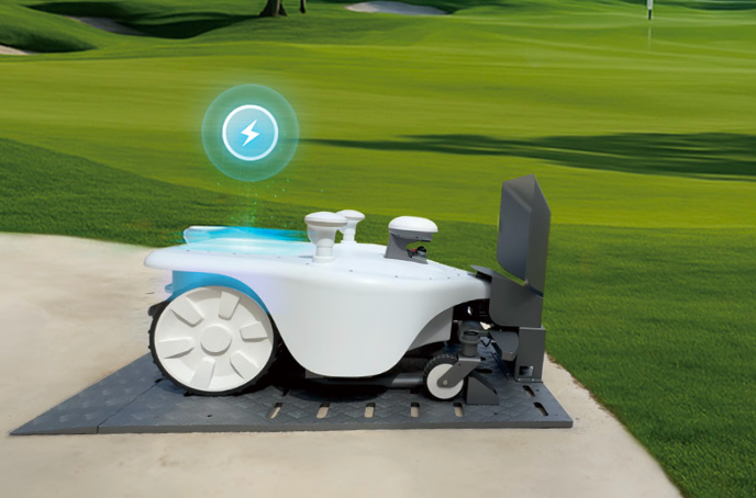 FJDynamics FRX robotic lawn mower on grass with charging station