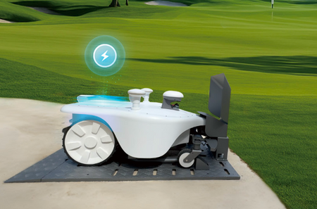FJDynamics FRX robotic lawn mower on grass with charging station