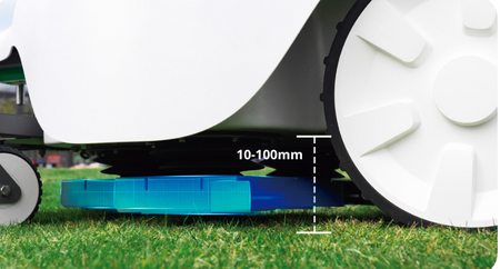 Close-up of robotic mower cutting grass with ground clearance measurement